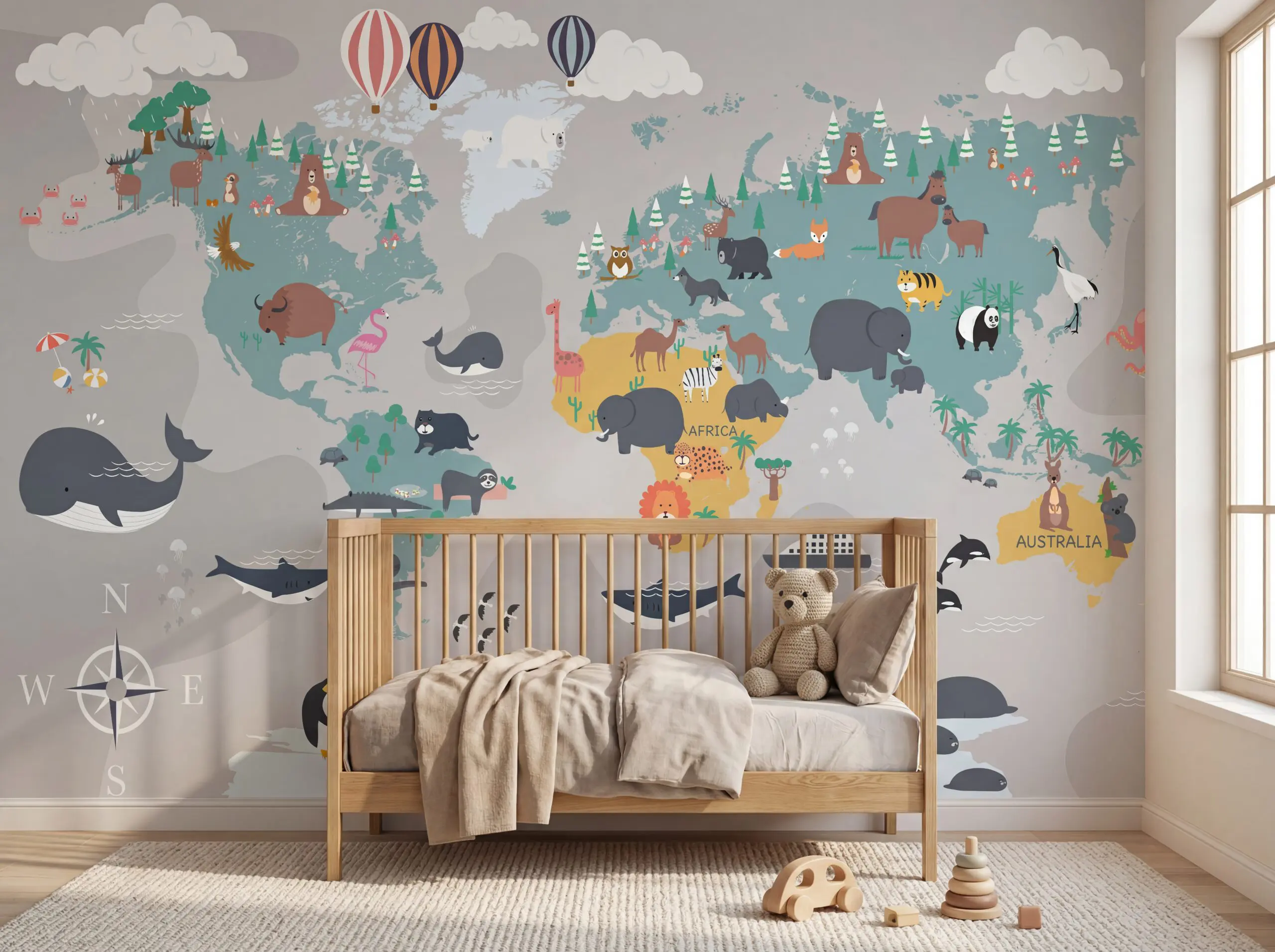Wandkult XXL Tapetenmotiv „Tierweltkarte“ – Kinderzimmer-Weltkarte mit Kontinenten und Tierillustrationen in Grau, Blau und Grün, spielerisches Lernmotiv im skandinavischen Stil. Installiert in einem Kinderzimmer